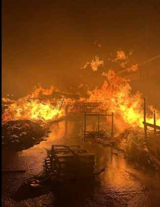 Flames engulfing the Livengood Pallet Service yard during the 2017 fire